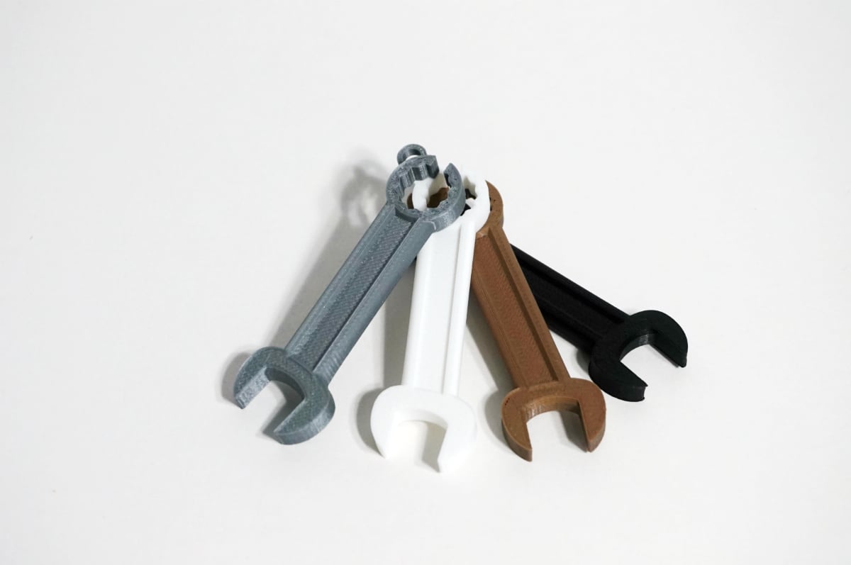 Wrench shaped earphone holder