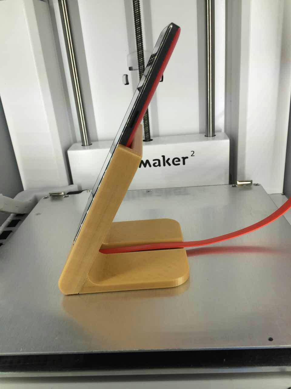 Phone stand with charging cord (Oneplus One)