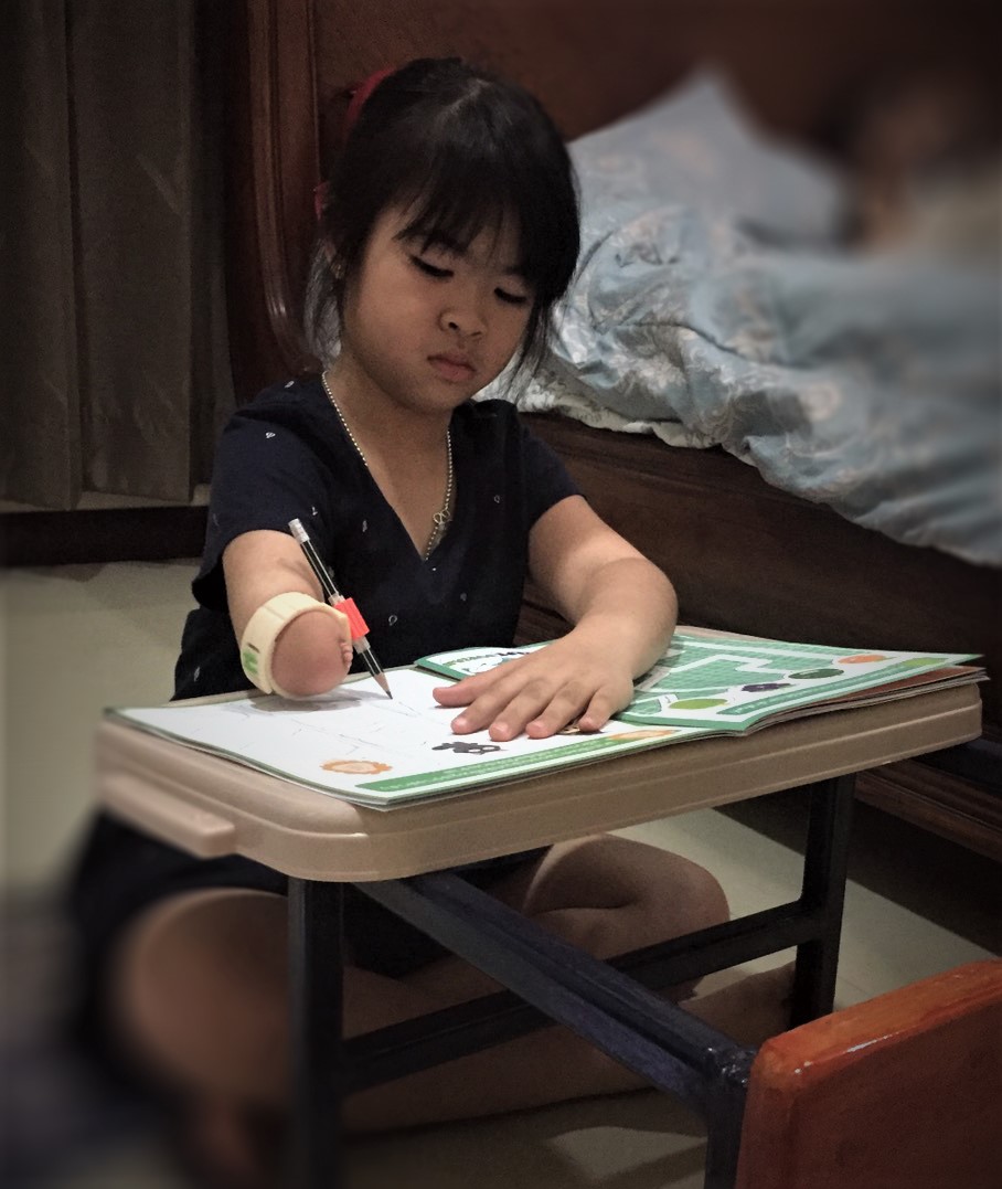 Thai Reach PIEBAND armband system for limb difference accessibility and creativity