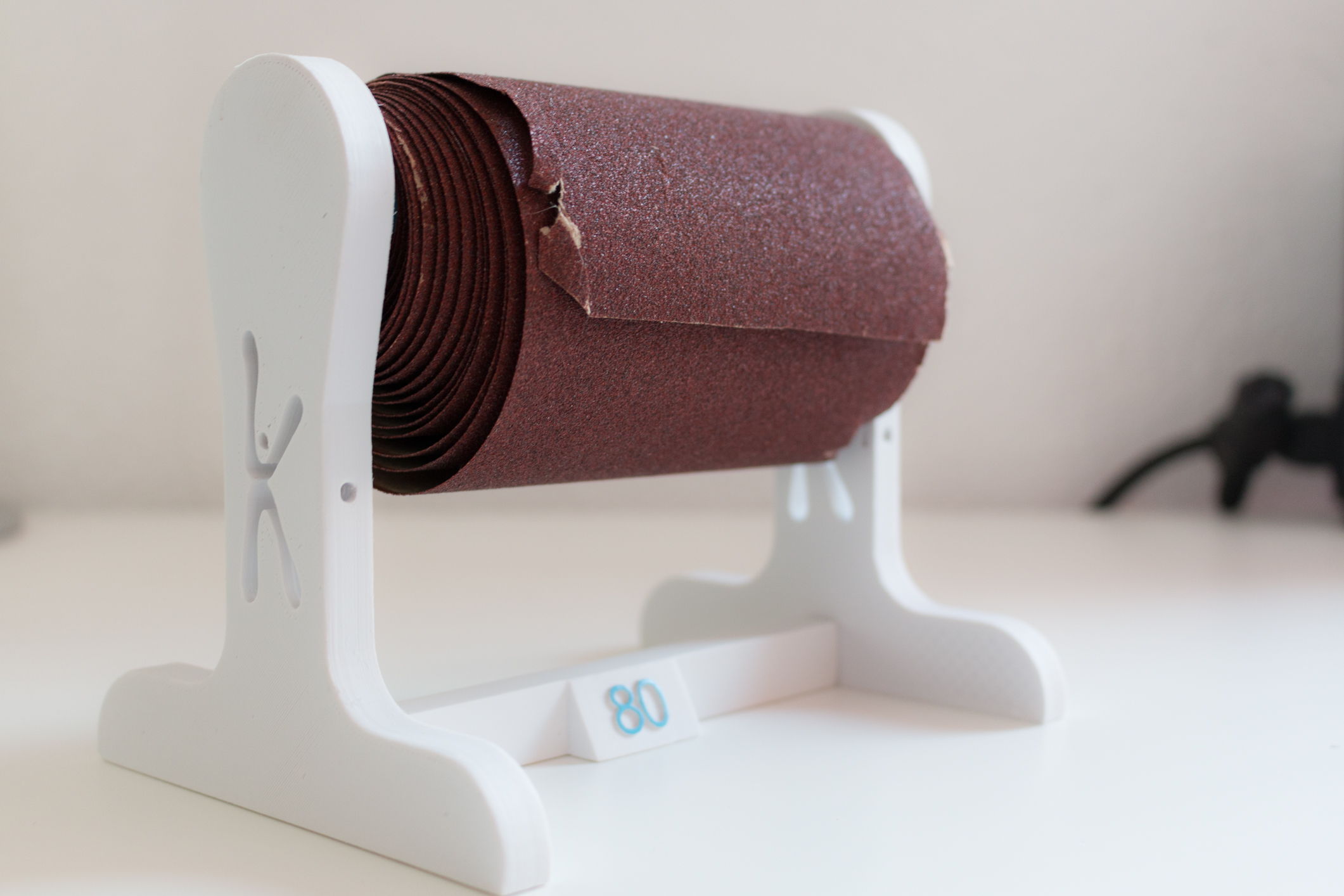 Sand paper spindle bracket