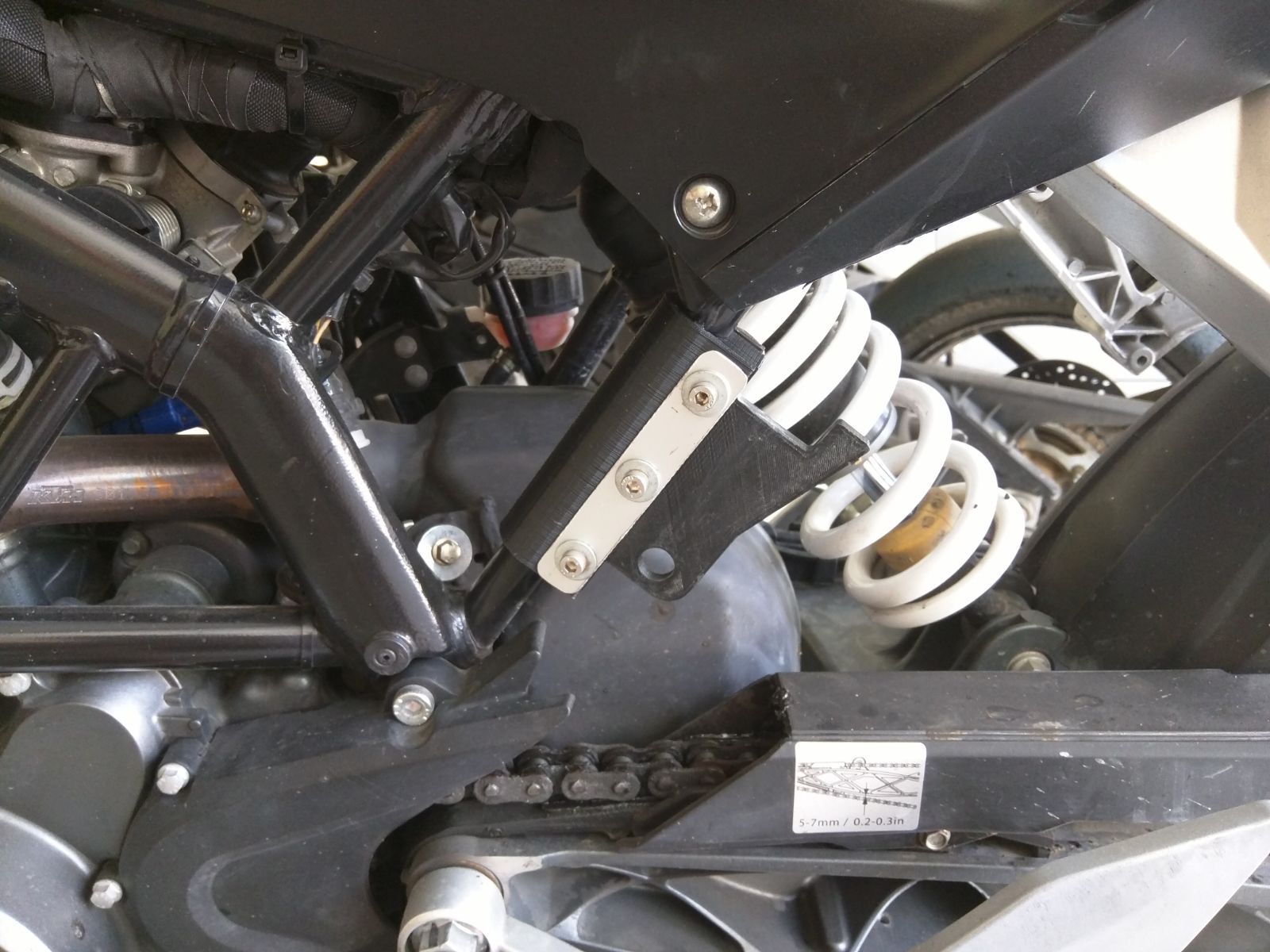 Padlock stand adapter support in motorbike chassis