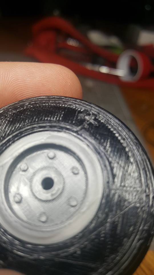 2 inch RC airplane wheel with a 3 mm center hole.