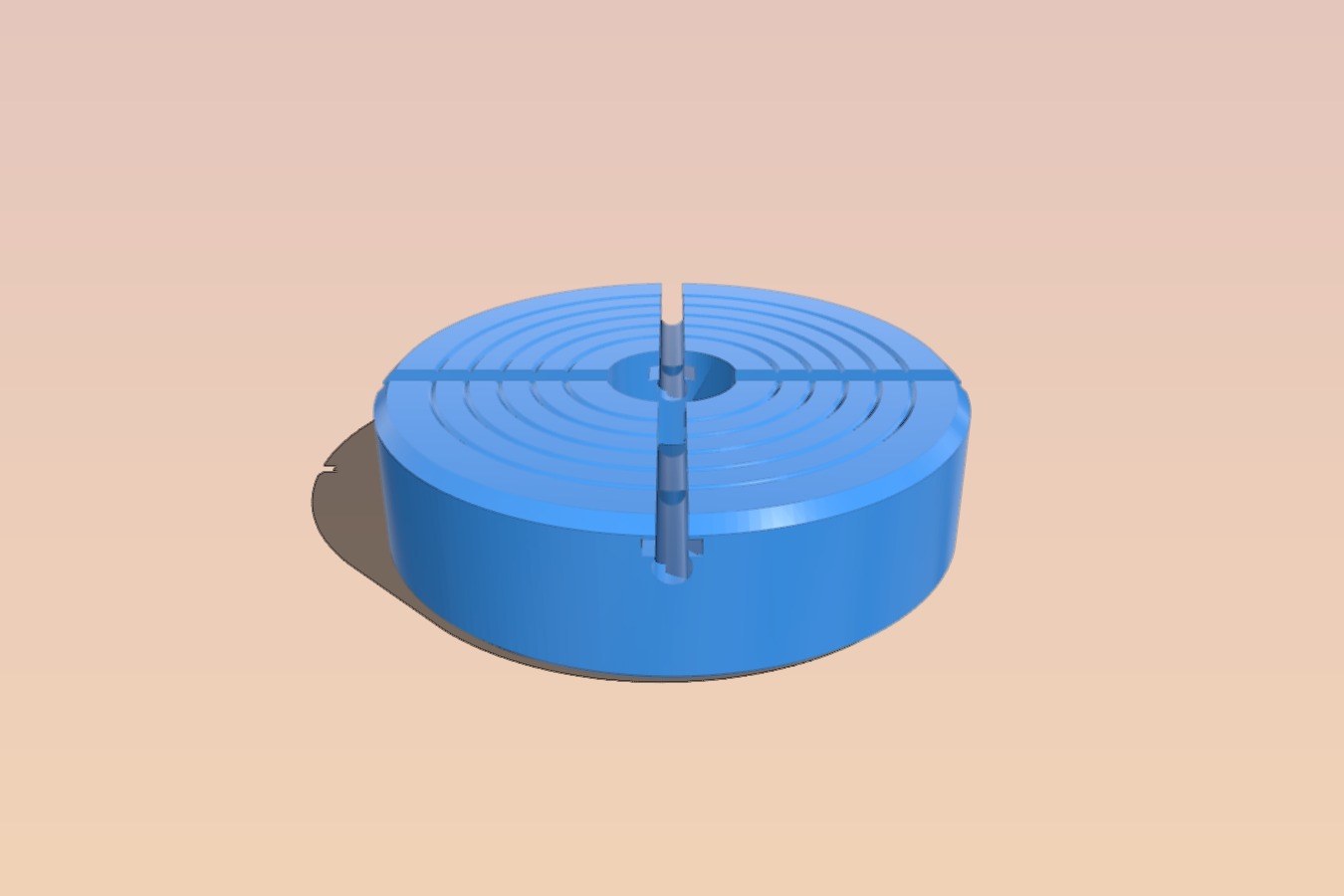 Automated divider head with a four jaw chuck