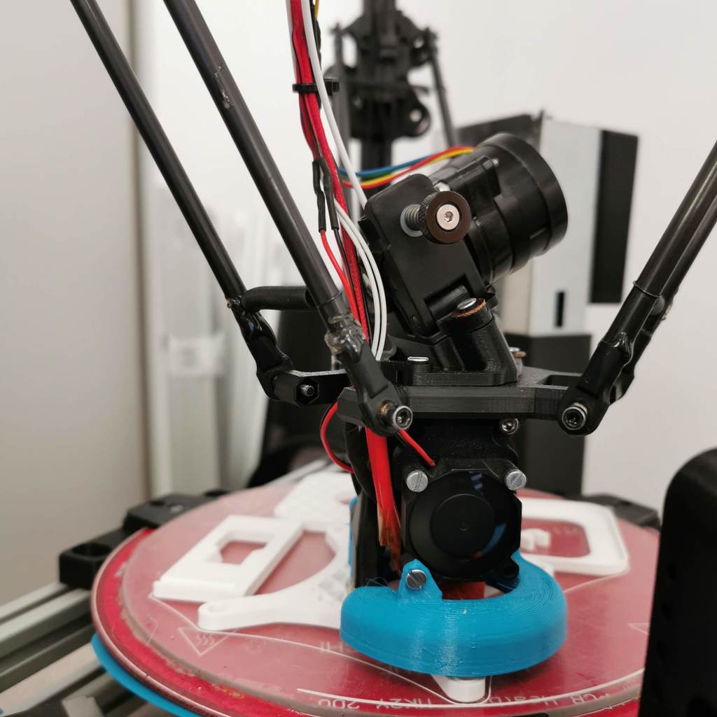 Delta effector with orbiter extruder