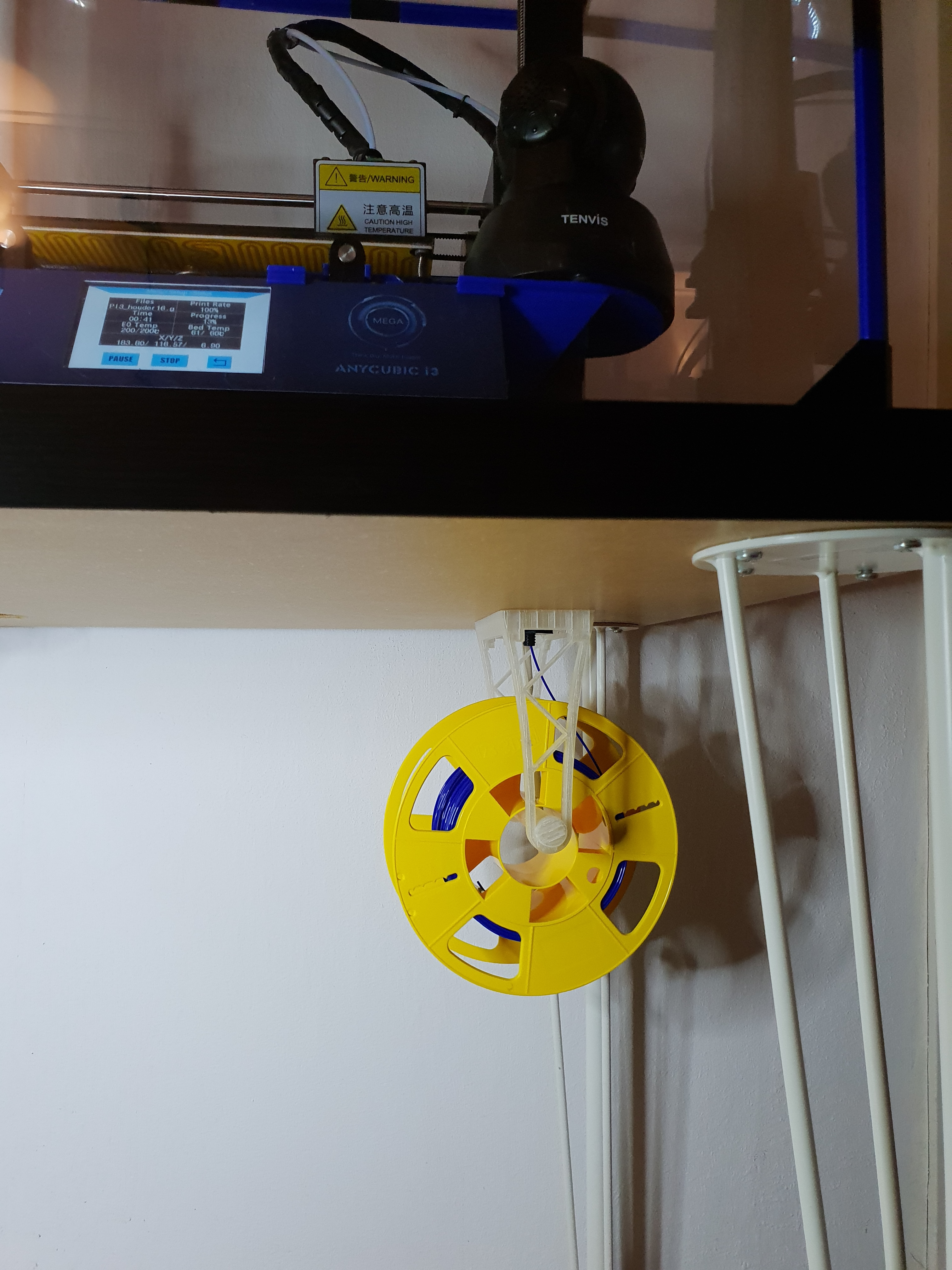 Filament holder hanging on filament entry through Ikea desk