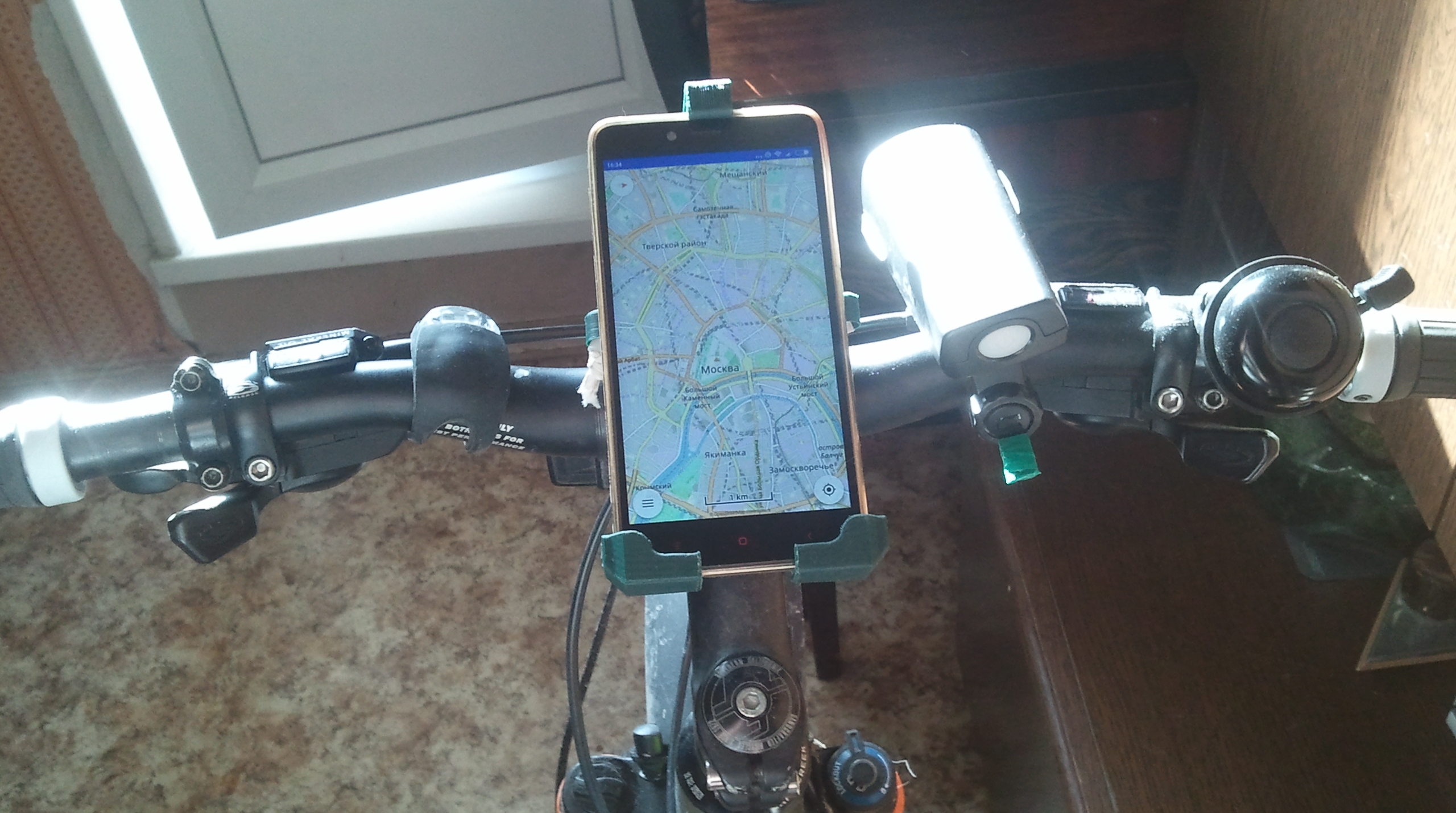 Phone holder to bike handlebar