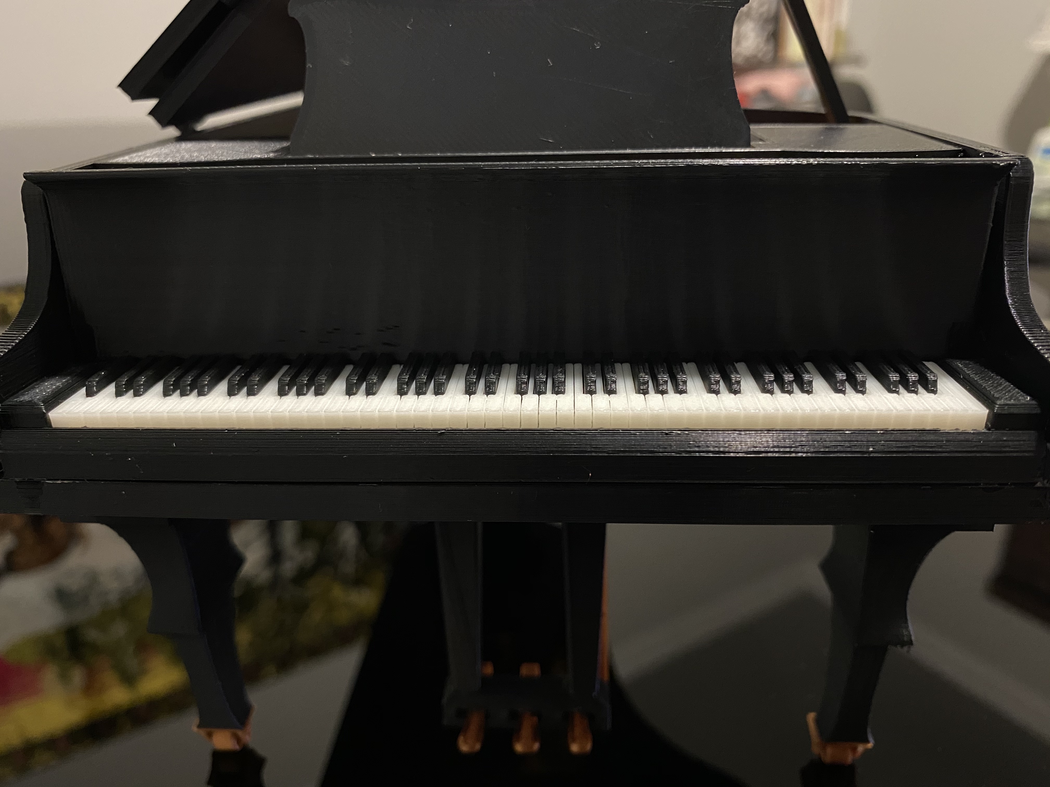 Grand piano with moving parts