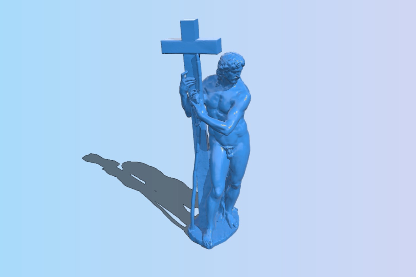 Statue of Jesus standing next to the cross