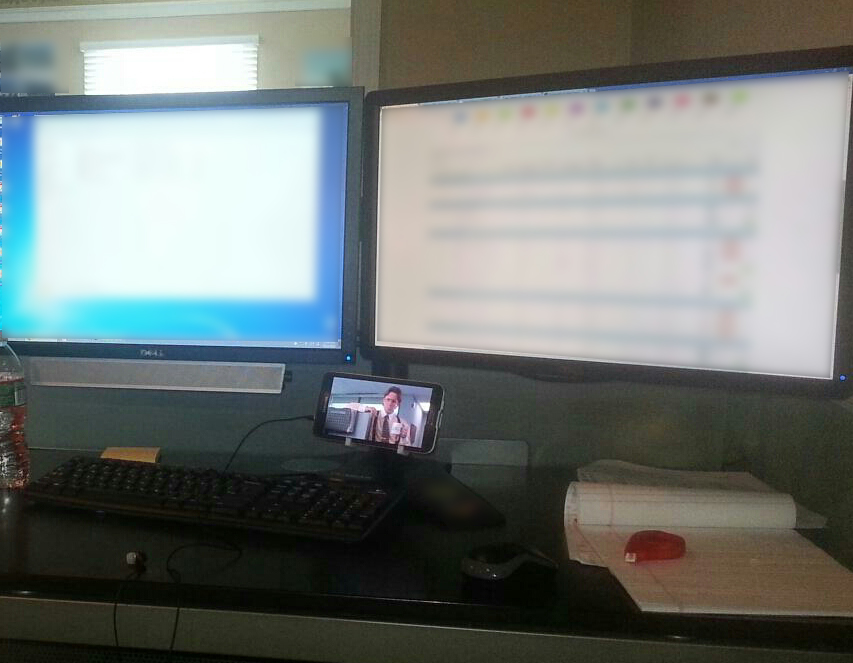Phone holder for dual monitor stand
