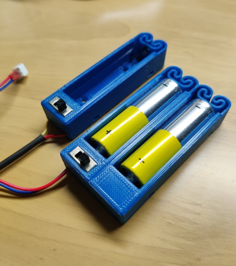 Flexing battery holders with switch and push to pop
