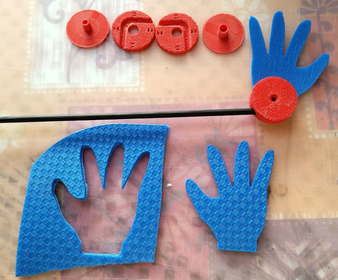 Rotating puppet hand rod holder