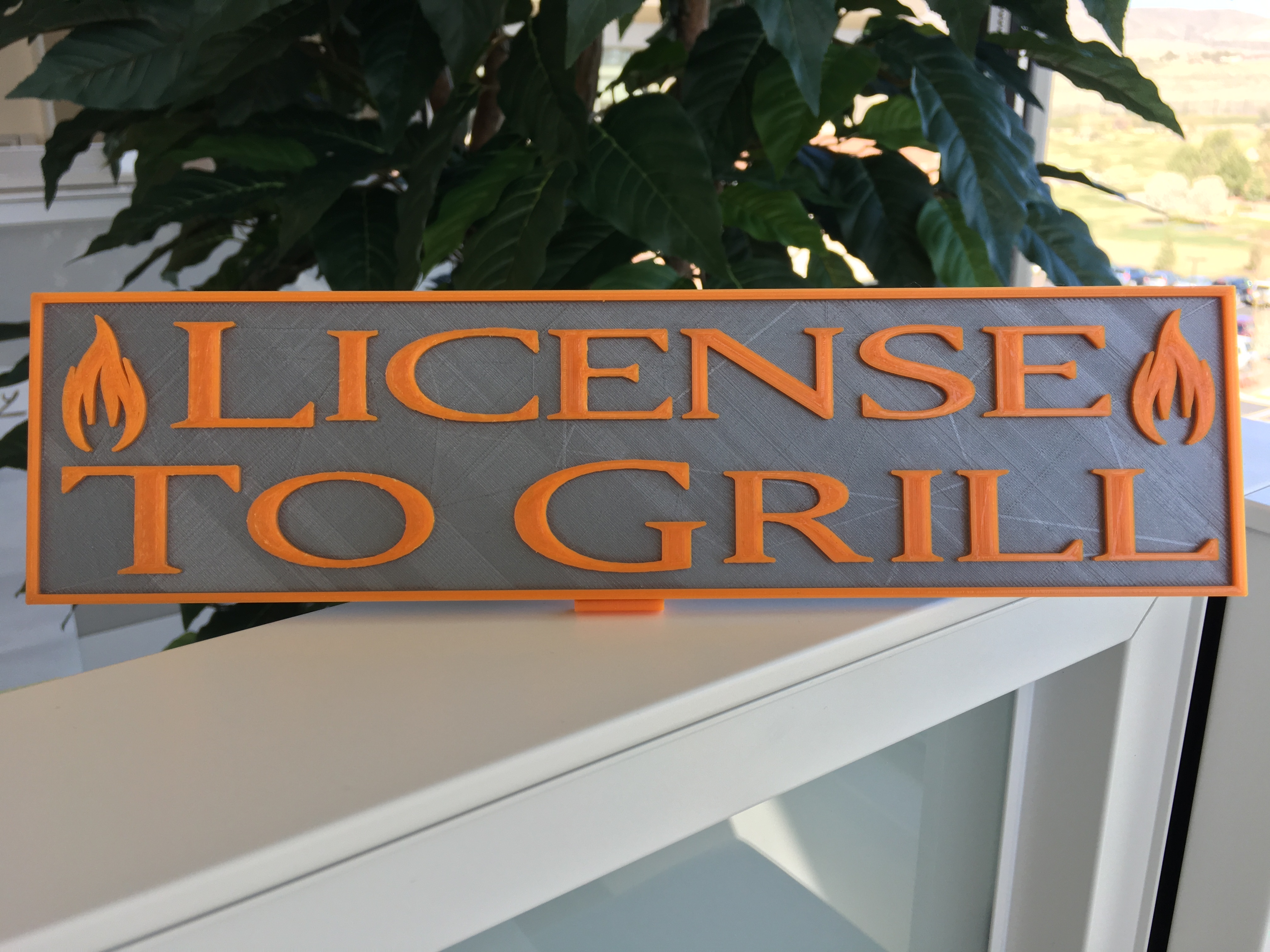 License to Grill placard